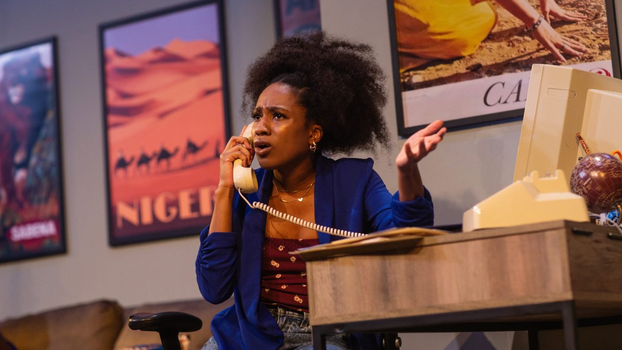 Ayamma (Angel Adedokun) works at her parents' travel agency in San Francisco Playhouse's "Nollywood Dreams," performing September 28 - November 4, 2023.
