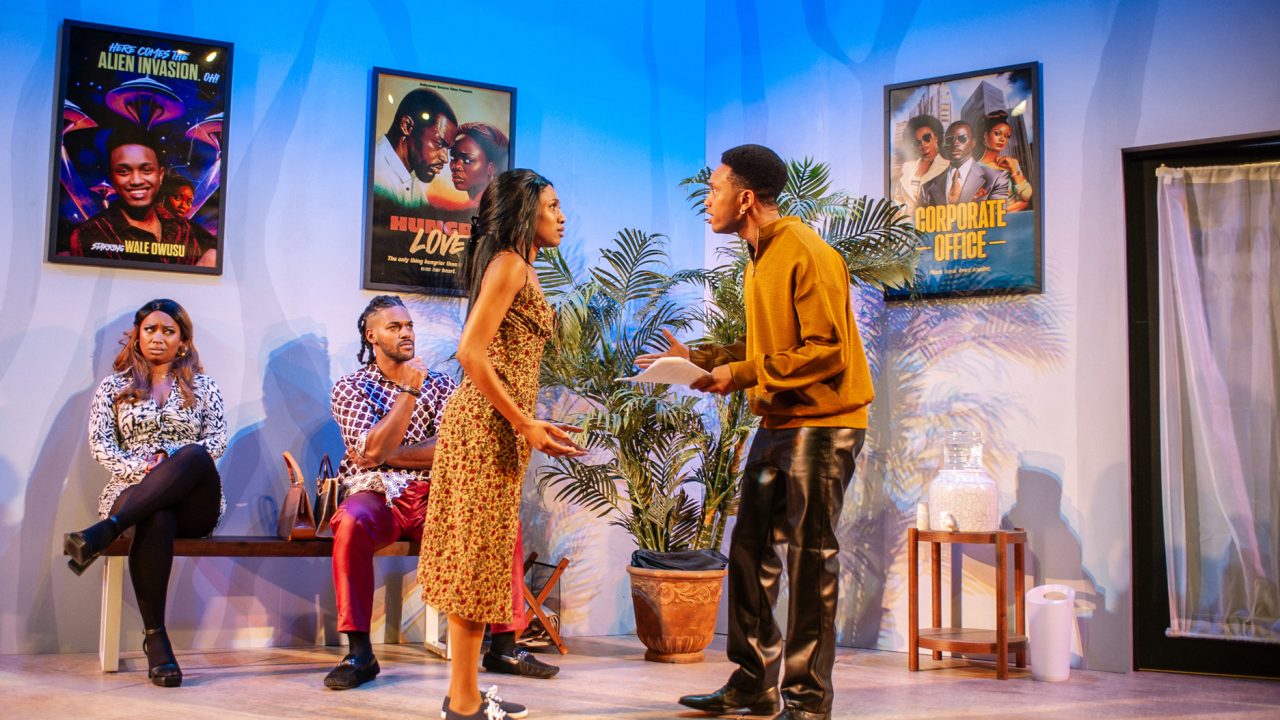 Fayola (Anna Marie Sharpe) and Gbenga (Tre'Vonne Bell) watch as Ayamma (Angel Adedokun) and Wale (Jordan Covington) perform a scene in San Francisco Playhouse's "Nollywood Dreams," performing September 28 - November 4, 2023.