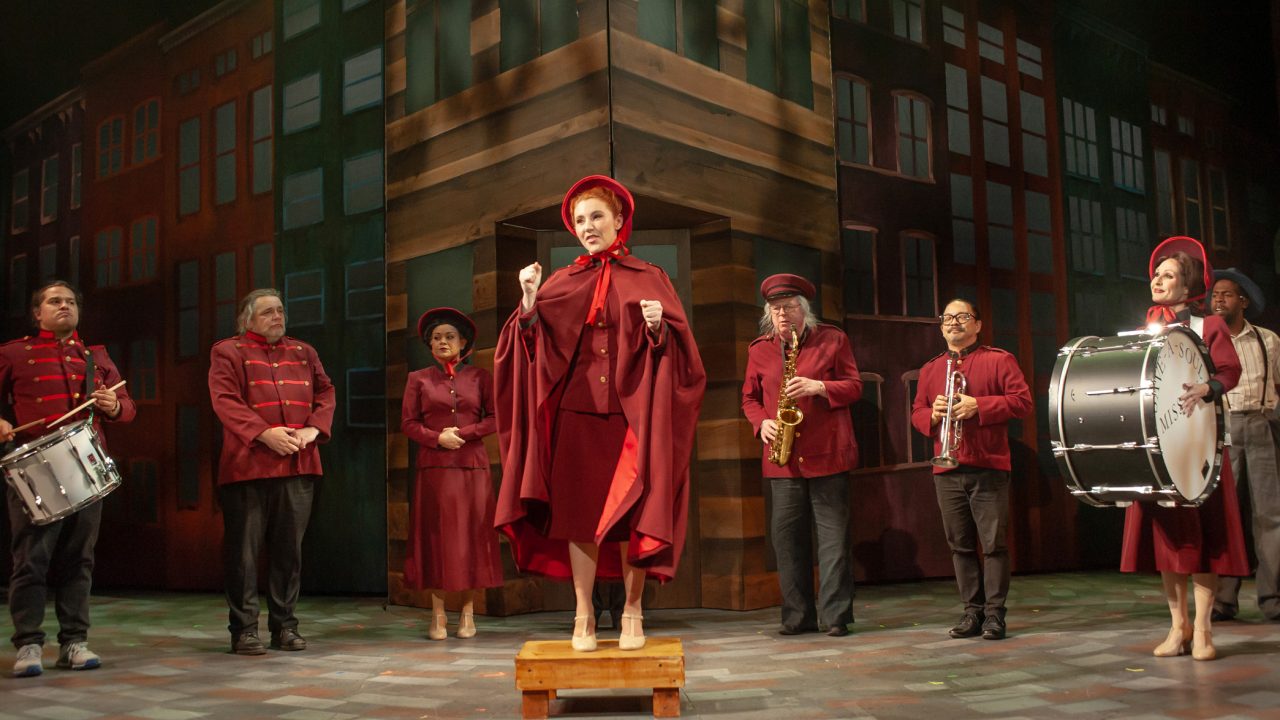 Sergeant Sarah Brown (center: Abigail Esfira Campbell) tries to enlist sinners for the Save-A-Soul Mission in San Francisco Playhouse's "Guys and Dolls," performing November 16, 2023 - January 13, 2024.