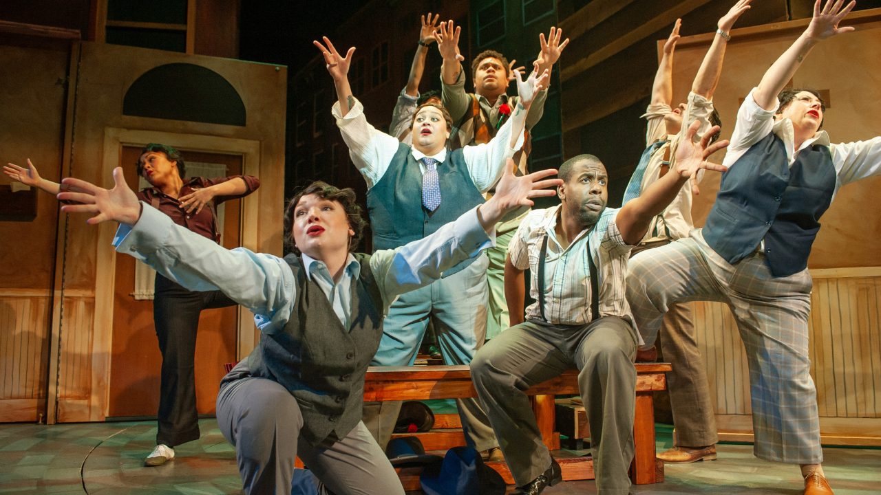 Gamblers see the light at a revival meeting in San Francisco Playhouse's "Guys and Dolls," performing November 16, 2023 - January 13, 2024.