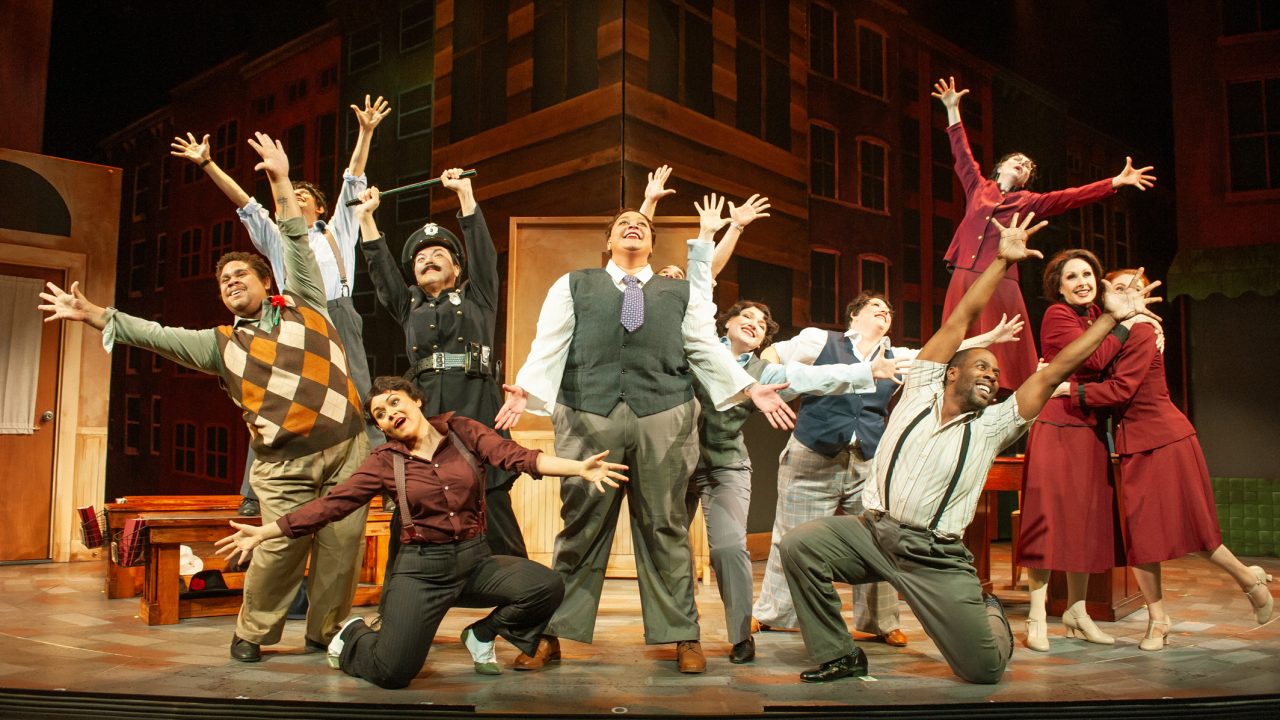 A repentant Nicely-Nicely (Kay Loren - center) describes a heavenly journey in San Francisco Playhouse's "Guys and Dolls," performing November 16, 2023 - January 13, 2024.