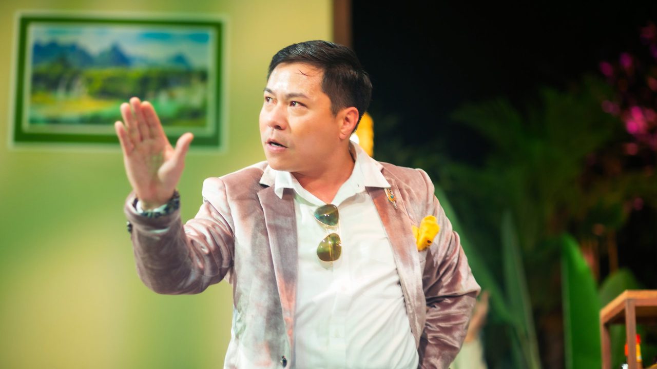 A food critic (Will Dao) enters the restaurant in San Francisco Playhouse's World Premiere Play "My Home on the Moon," performing January 25 - February 24.