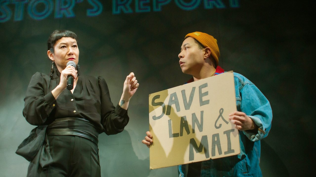 CEO Gigi (Erin Mei-Ling Stuart) leads an investor's report protested by Beau (Will Dao) in San Francisco Playhouse's World Premiere Play "My Home on the Moon," performing January 25 - February 24.