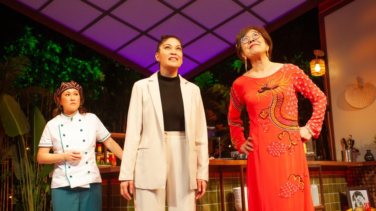 Mai (Jenny Nguyen Nelson), Vera (Rinabeth Apostol), and Lan (Sharon Omi) celebrate the new year in San Francisco Playhouse's World Premiere Play "My Home on the Moon," performing January 25 - February 24.