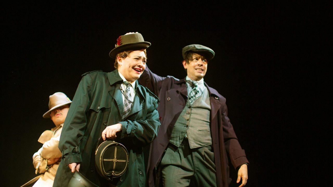 Richard Hannay (Phil Wong) evades a salesman (Renee Rogoff) and a newsboy (Greg Ayers) on the train in "The 39 Steps," presented by San Francisco Playhouse March 7 - April 20.