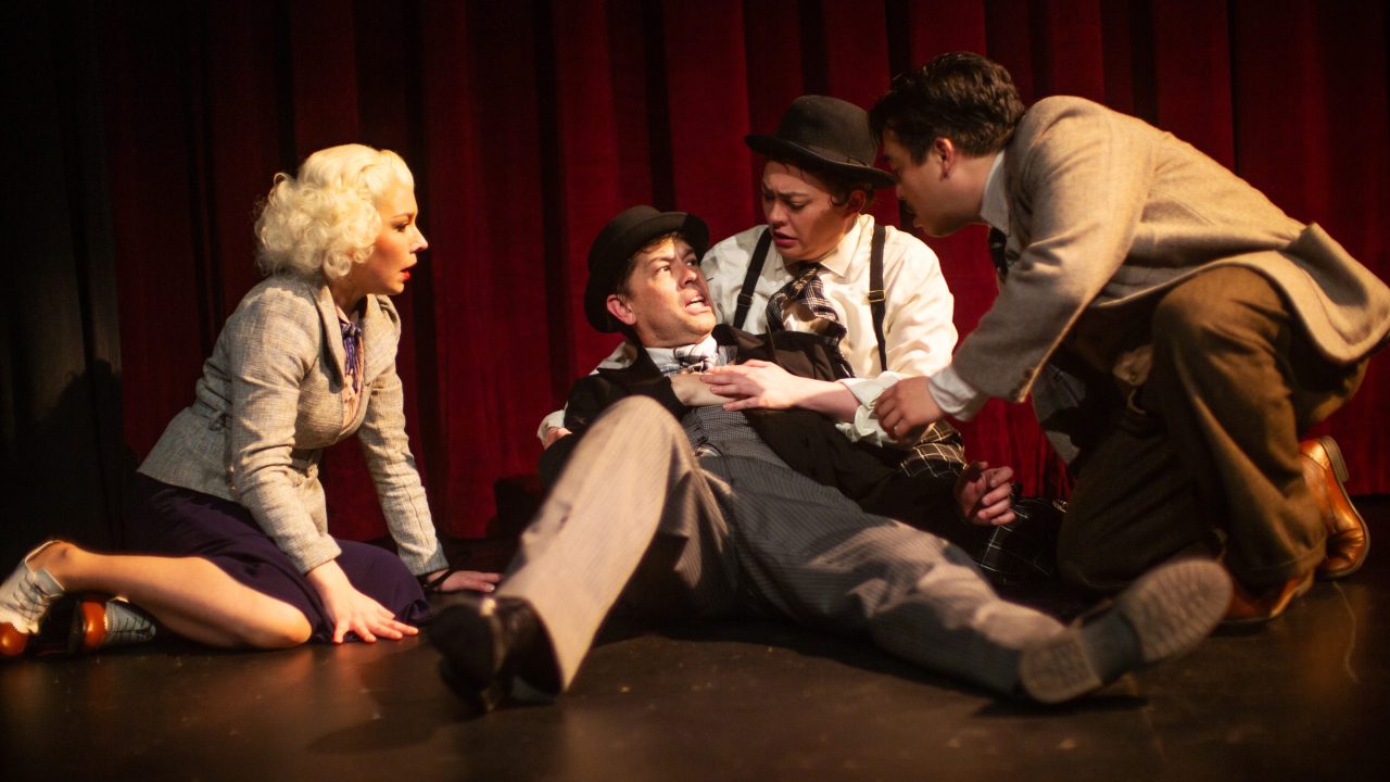 l to r: Pamela (Maggie Mason) listens as Mr. Memory (Greg Ayers) reveals secrets, held by Compere (Renee Rogoff) and questioned by Richard Hannay (Phil Wong) in "The 39 Steps," presented by San Francisco Playhouse March 7 - April 20. l to r: Pamela (Maggie Mason) listens as Mr. Memory (Greg Ayers) reveals secrets, held by Compere (Renee Rogoff) and questioned by Richard Hannay (Phil Wong) in "The 39 Steps," presented by San Francisco Playhouse March 7 - April 20.