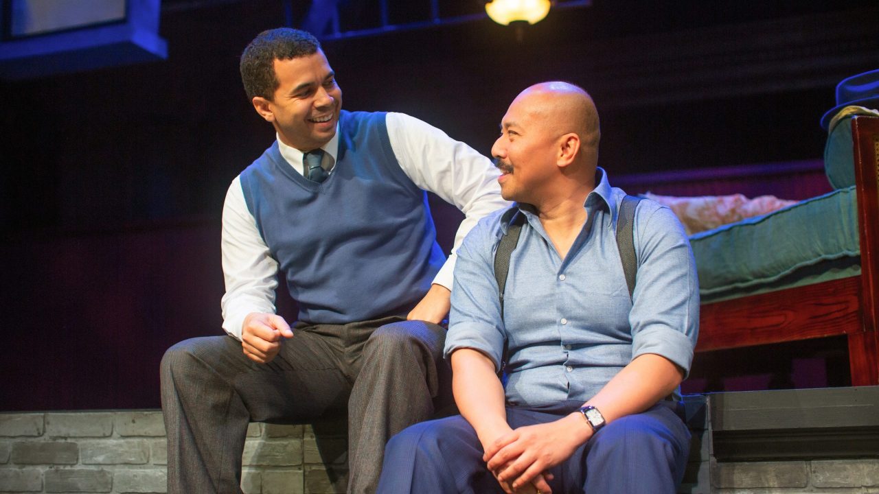 Work friends Jim (William Thomas Hodgson) and Tom (Jomar Tagatac) catch up in San Francisco Playhouse's "The Glass Menagerie," performing May 2 - June 15. Work friends Jim (William Thomas Hodgson) and Tom (Jomar Tagatac) catch up in San Francisco Playhouse's "The Glass Menagerie," performing May 2 - June 15.