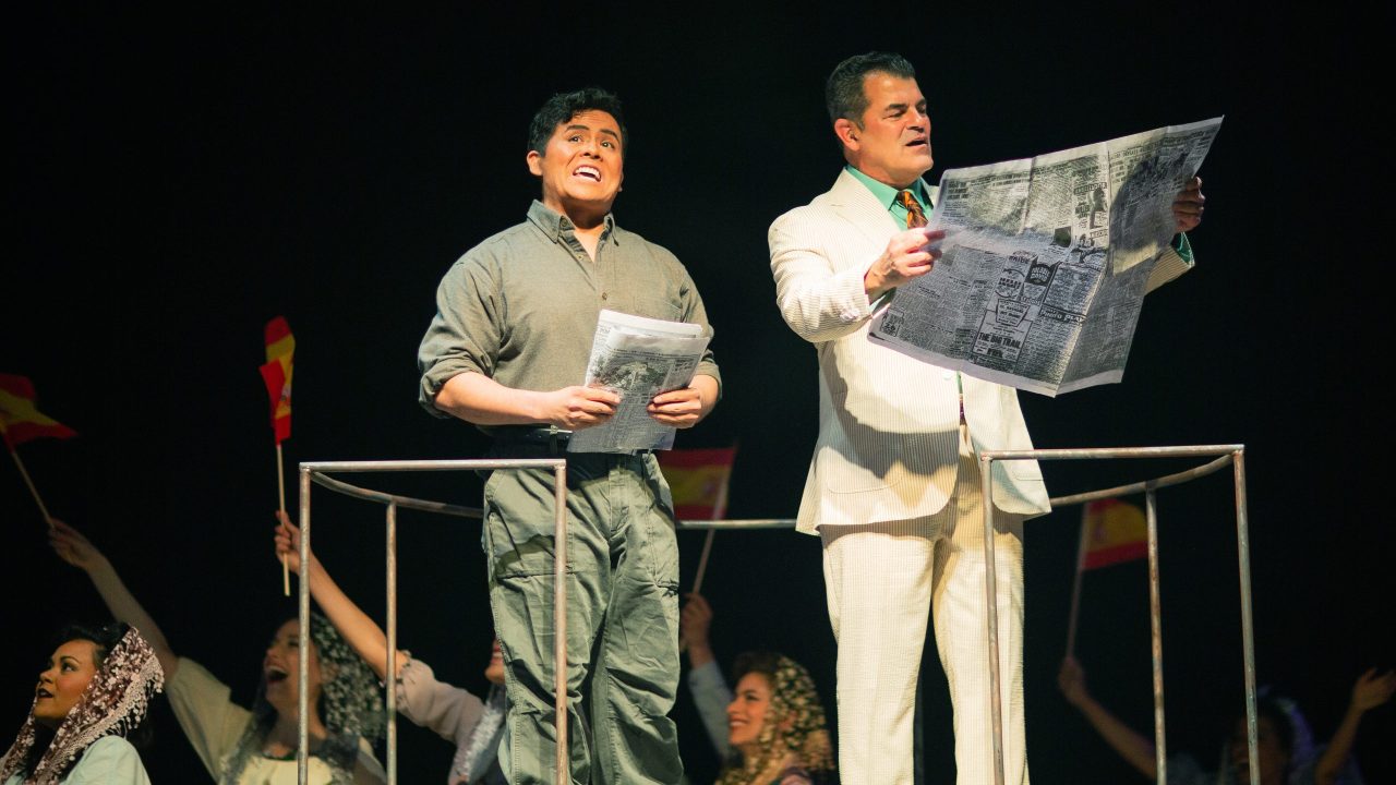 Che (Alex Rodriguez) comments on Juan Perón (Peter Gregus) in San Francisco Playhouse's "Evita," performing June 27 - September 7, 2024. Che (Alex Rodriguez) comments on Juan Perón (Peter Gregus) in San Francisco Playhouse's "Evita," performing June 27 - September 7, 2024.