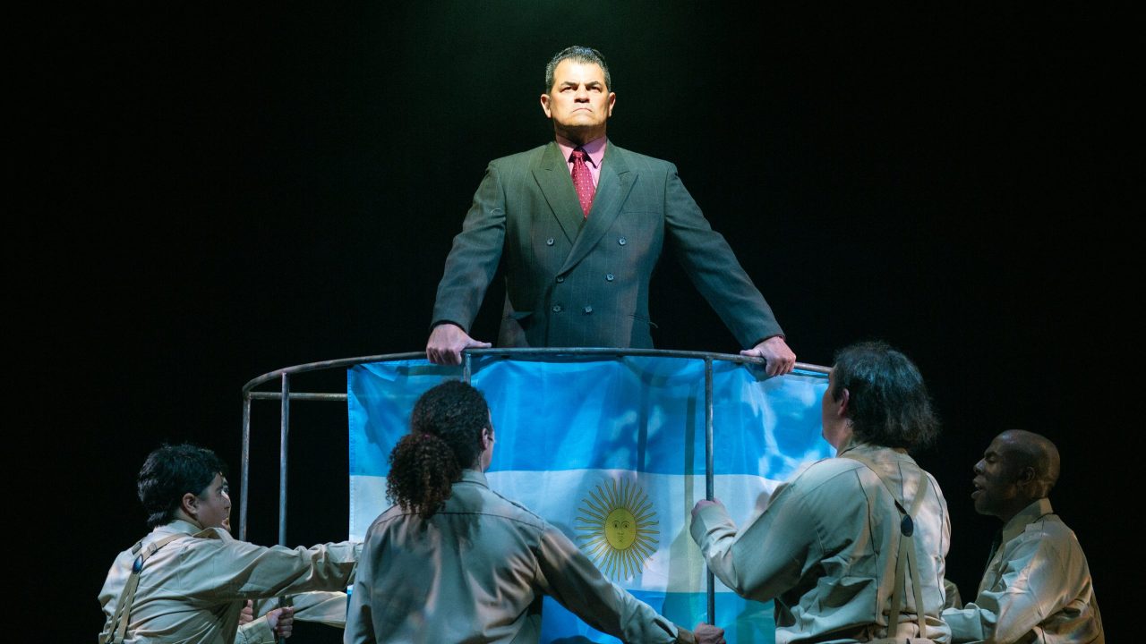 Juan Perón (Peter Gregus) addresses the public in San Francisco Playhouse's "Evita," performing June 27 - September 7, 2024. Juan Perón (Peter Gregus) addresses the public in San Francisco Playhouse's "Evita," performing June 27 - September 7, 2024.