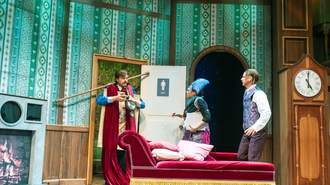 Jonathan (Adam Griffith) struggles with props, startling Annie (Renee Rogoff) and Robert (Patrick Russell) in "The Play That Goes Wrong," presented by San Francisco Playhouse September 21 - November 9. "The Play That Goes Wrong" production photo.