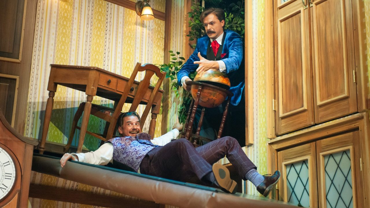 Robert (Patrick Russell) and Jonathan (Adam Griffith) struggle to keep their balance in "The Play That Goes Wrong," presented by San Francisco Playhouse September 21 - November 9. "The Play That Goes Wrong" production photo.