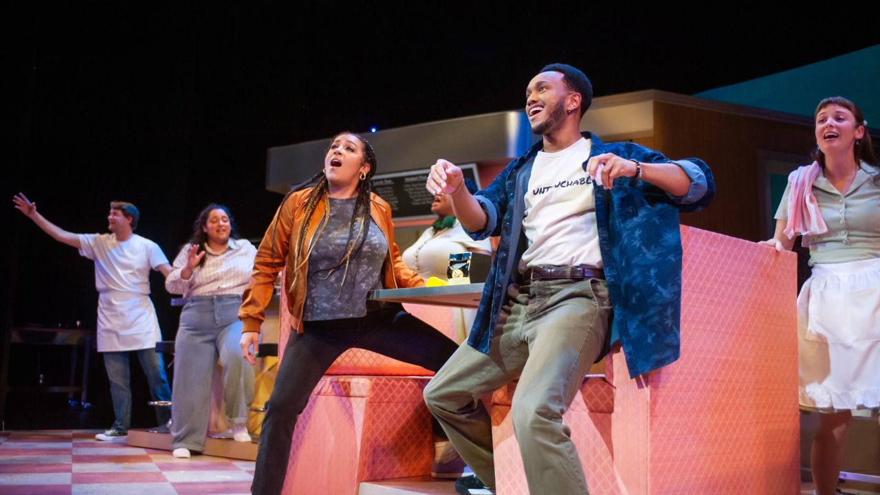 The diners' patrons and waitresses (l to r: Milo Boland, Alexandra Rivers, Lucca Troutman, Tanika Baptiste, Jordan Covington, and Ruby Day) start the day in "Waitress," presented by San Francisco Playhouse November 21 – January 18. "Waitress" production photo.