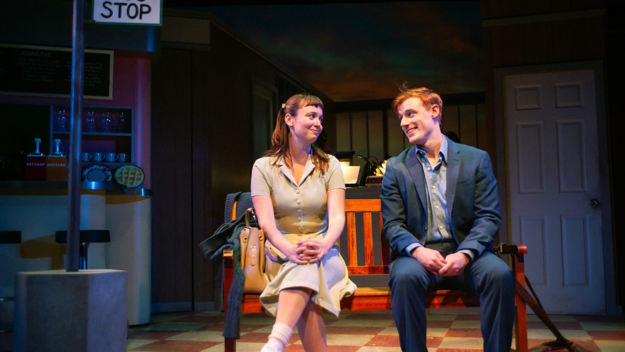 Jenna (Ruby Day) runs into Dr. Pomatter (Zeke Edmonds) at the bus stop in "Waitress," presented by San Francisco Playhouse November 21 – January 18. "Waitress" production photo.