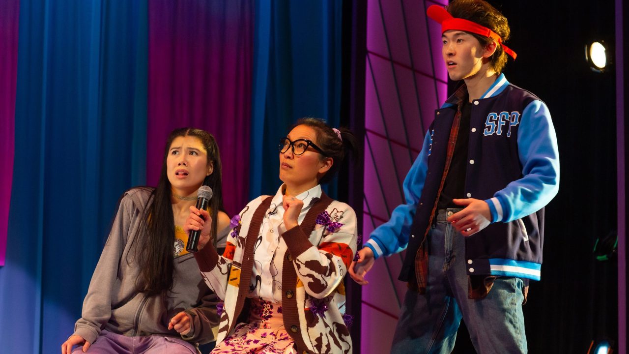 Ami (Ana Ming Bostwick-Singer), Mrs. Jamholder (Nicole Tung), and Ben (Edric Young) watch Exotic Deadly perform at the talent show in San Francisco Playhouse's "Exotic Deadly: Or the MSG Play," performing January 30 - March 8. Ami (Ana Ming Bostwick-Singer), Mrs. Jamholder (Nicole Tung), and Ben (Edric Young) watch Exotic Deadly perform at the talent show in San Francisco Playhouse's "Exotic Deadly: Or the MSG Play," performing January 30 - March 8.