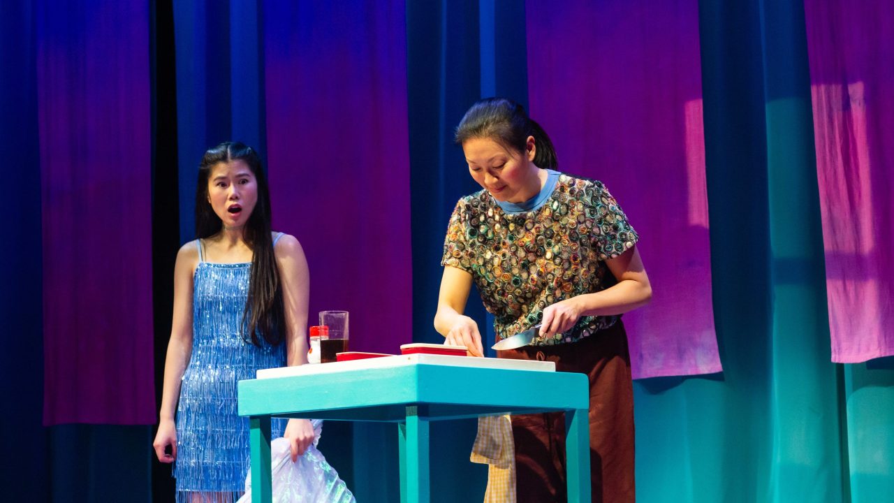 Ami (Ana Ming Bostwick-Singer) is shocked at her mother's (Nicole Tung) revelation in San Francisco Playhouse's "Exotic Deadly: Or the MSG Play," performing January 30 - March 8. Ami (Ana Ming Bostwick-Singer) is shocked at her mother's (Nicole Tung) revelation in San Francisco Playhouse's "Exotic Deadly: Or the MSG Play," performing January 30 - March 8.