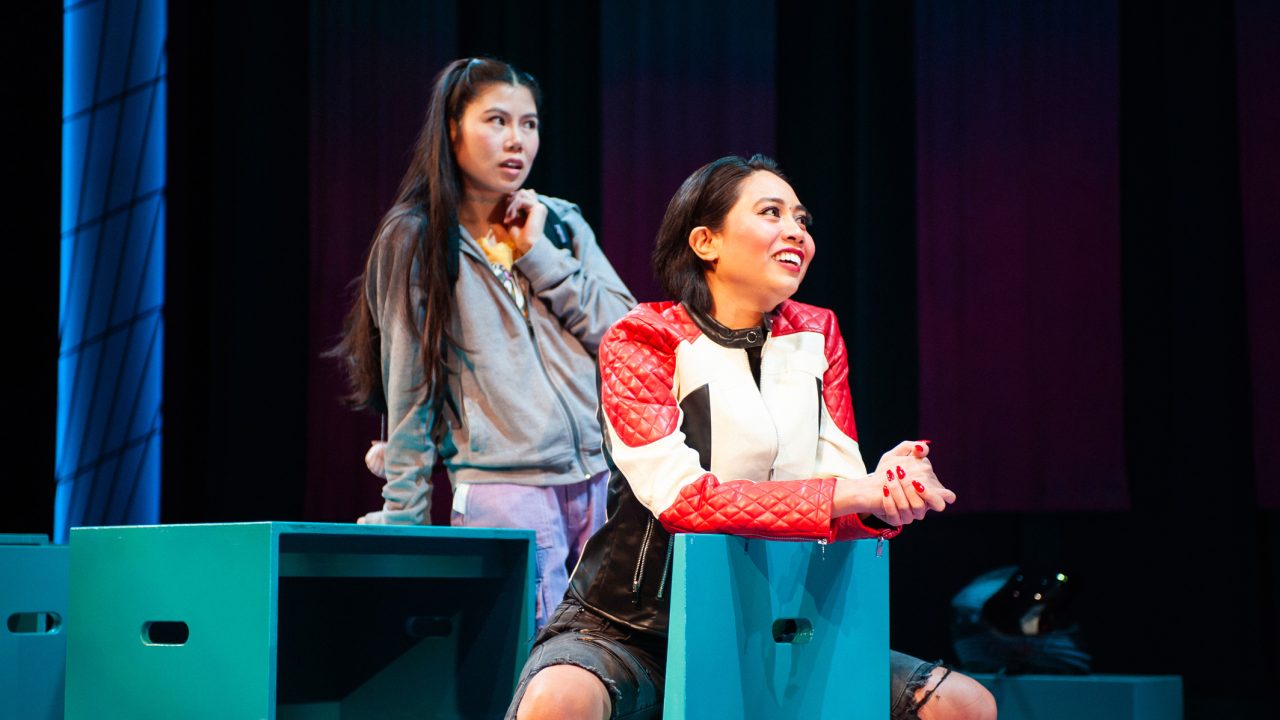 Ami (Ana Ming Bostwick-Singer) goes along with Exotic Deadly's (Francesca Fernandez) plan in San Francisco Playhouse's "Exotic Deadly: Or the MSG Play," performing January 30 - March 8. Ami (Ana Ming Bostwick-Singer) goes along with Exotic Deadly's (Francesca Fernandez) plan in San Francisco Playhouse's "Exotic Deadly: Or the MSG Play," performing January 30 - March 8.