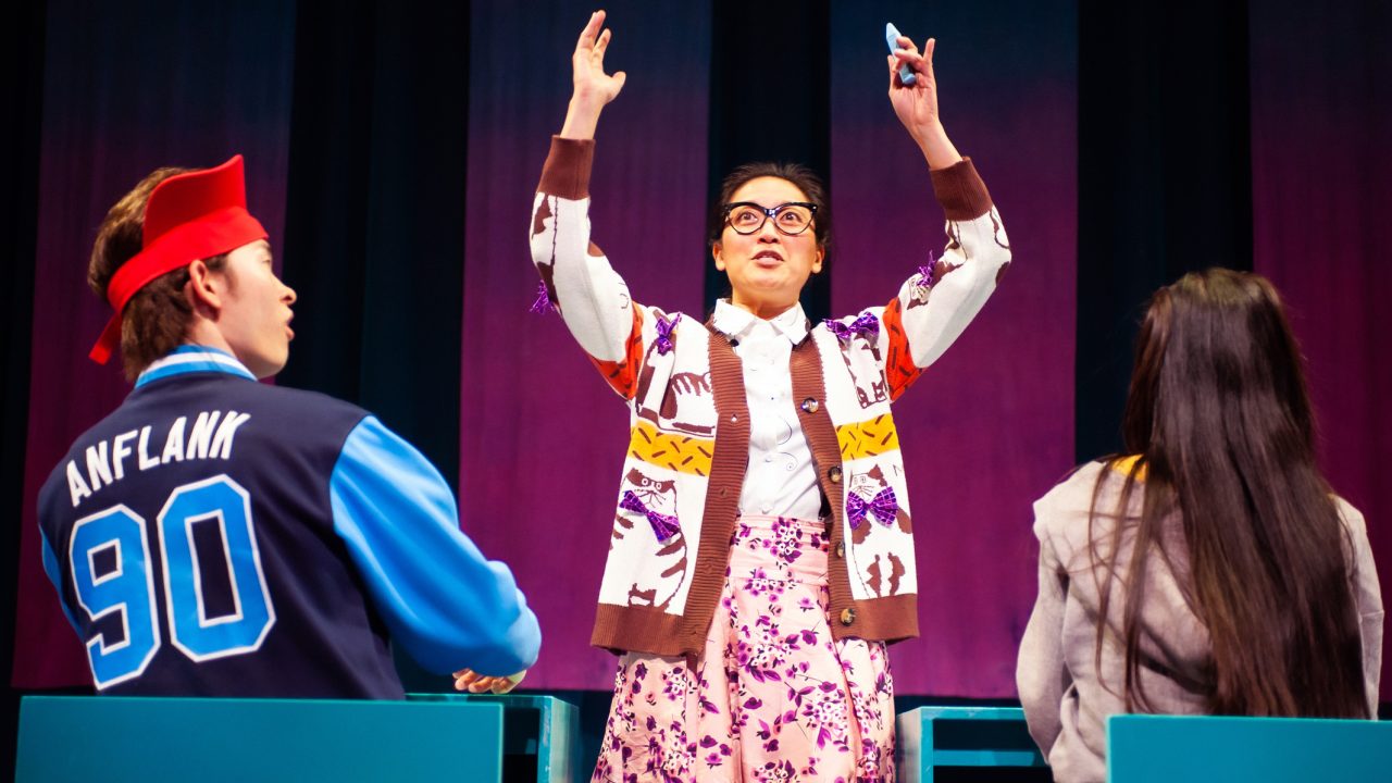 Ben (Edric Young) listens to teacher Mrs. Jamholder (Nicole Tung) in class with Ami (Ana Ming Bostwick-Singer) in San Francisco Playhouse's "Exotic Deadly: Or the MSG Play," performing January 30 - March 8. Ben (Edric Young) listens to teacher Mrs. Jamholder (Nicole Tung) in class with Ami (Ana Ming Bostwick-Singer) in San Francisco Playhouse's "Exotic Deadly: Or the MSG Play," performing January 30 - March 8.