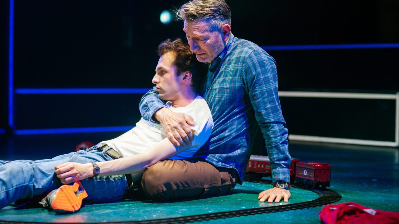 Christopher (Brendan Looney) is embraced by his father Ed (Mark P. Robinson) in San Francisco Playhouse's "The Curious Incident of the Dog in the Night-Time," performing May 1 - June 21. Christopher (Brendan Looney) is embraced by his father Ed (Mark P. Robinson) in San Francisco Playhouse's "The Curious Incident of the Dog in the Night-Time," performing May 1 - June 21.