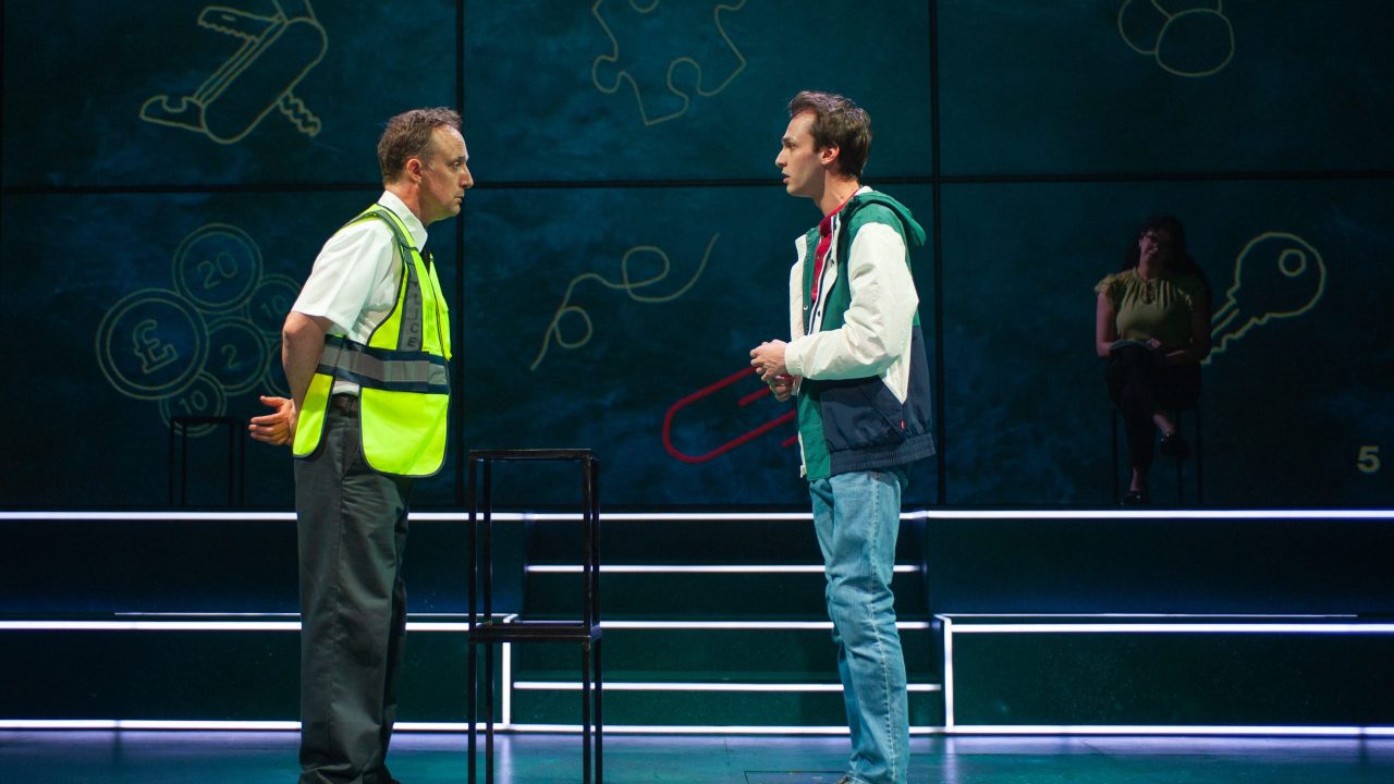 A duty sergeant (Cassidy Brown) interviews Christopher (Brendan Looney) in San Francisco Playhouse's "The Curious Incident of the Dog in the Night-Time," performing May 1 - June 21. A duty sergeant (Cassidy Brown) interviews Christopher (Brendan Looney) in San Francisco Playhouse's "The Curious Incident of the Dog in the Night-Time," performing May 1 - June 21.