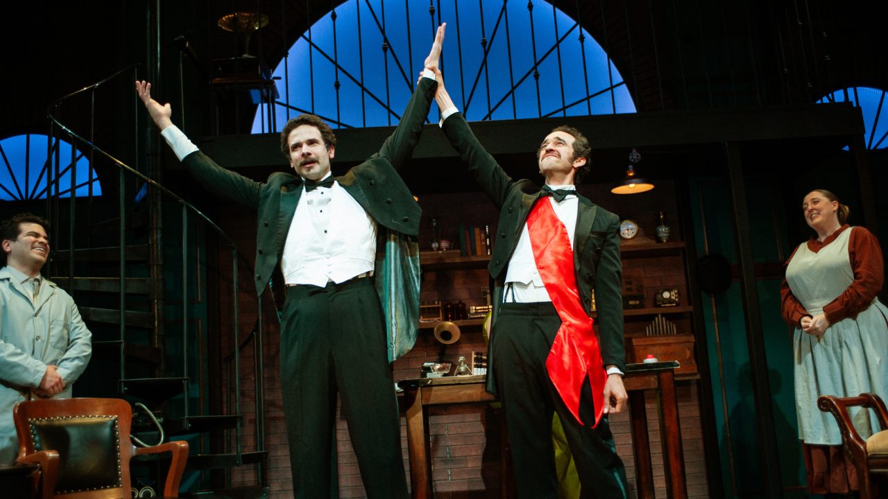 Professor Higgins (center left - Adam Magill) is congratulated by his staff (Julio Chavez), Colonel Pickering (Brady Morales-Woolery) and Mrs. Pearce (Heather Orth) in San Francisco Playhouse's "My Fair Lady," performing July 3 - September 13, 2025. Professor Higgins (center left - Adam Magill) is congratulated by his staff (Julio Chavez), Colonel Pickering (Brady Morales-Woolery) and Mrs. Pearce (Heather Orth) in San Francisco Playhouse's "My Fair Lady," performing July 3 - September 13, 2025.