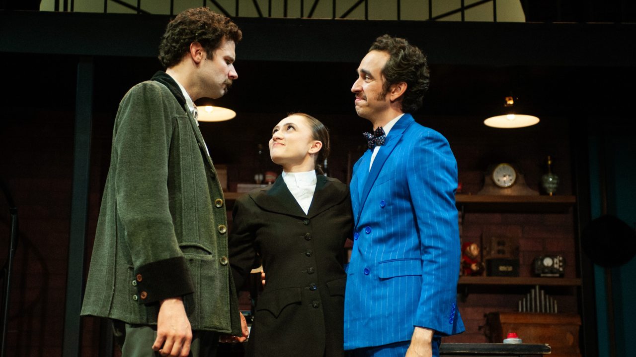 Professor Higgins (Adam Magill), Eliza (Jillian A. Smith), and Colonel Pickering (Brady Morales-Woolery) share a moment in San Francisco Playhouse's "My Fair Lady," performing July 3 - September 13, 2025. Professor Higgins (Adam Magill), Eliza (Jillian A. Smith), and Colonel Pickering (Brady Morales-Woolery) share a moment in San Francisco Playhouse's "My Fair Lady," performing July 3 - September 13, 2025.