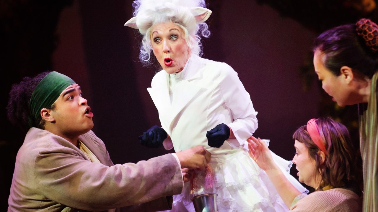 Jack (William I. Schmidt), The Baker's Wife (Ruby Day), and Jack's Mother (Eiko Moon-Yamamoto) try to milk the cow Milky White (Maureen McVerry) in San Francisco Playhouse's "Into the Woods," performing November 20, 2025 - January 17, 2026. Jack (William I. Schmidt), The Baker's Wife (Ruby Day), and Jack's Mother (Eiko Moon-Yamamoto) try to milk the cow Milky White (Maureen McVerry) in San Francisco Playhouse's "Into the Woods," performing November 20, 2025 - January 17, 2026.