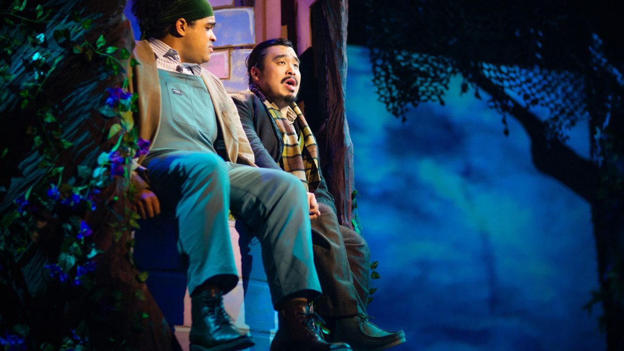 Jack (William I. Schmidt) listens to The Baker (Phil Wong) in San Francisco Playhouse's "Into the Woods," performing November 20, 2025 - January 17, 2026. Jack (William I. Schmidt) listens to The Baker (Phil Wong) in San Francisco Playhouse's "Into the Woods," performing November 20, 2025 - January 17, 2026.