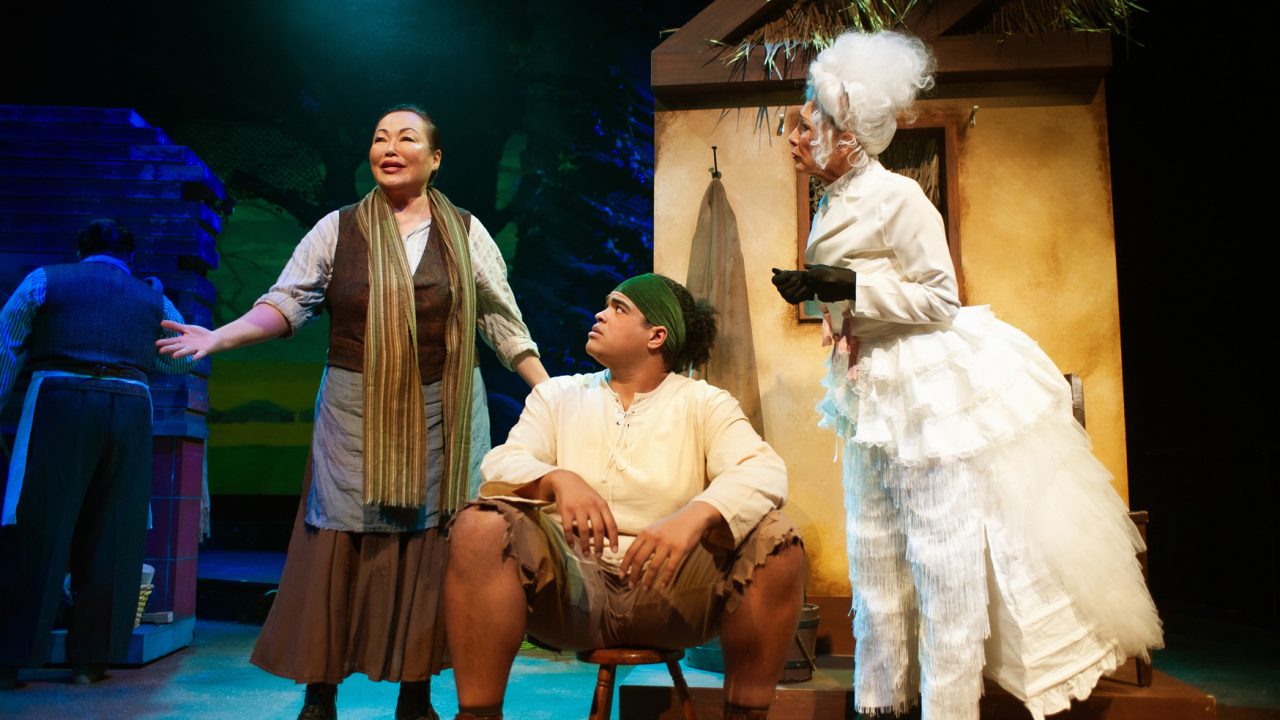 Jack's Mother (Eiko Moon-Yamamoto) and Jack (William I. Schmidt) consider the fate of Milky White (Maureen McVerry) in San Francisco Playhouse's "Into the Woods," performing November 20, 2025 - January 17, 2026. Jack's Mother (Eiko Moon-Yamamoto) and Jack (William I. Schmidt) consider the fate of Milky White (Maureen McVerry) in San Francisco Playhouse's "Into the Woods," performing November 20, 2025 - January 17, 2026.