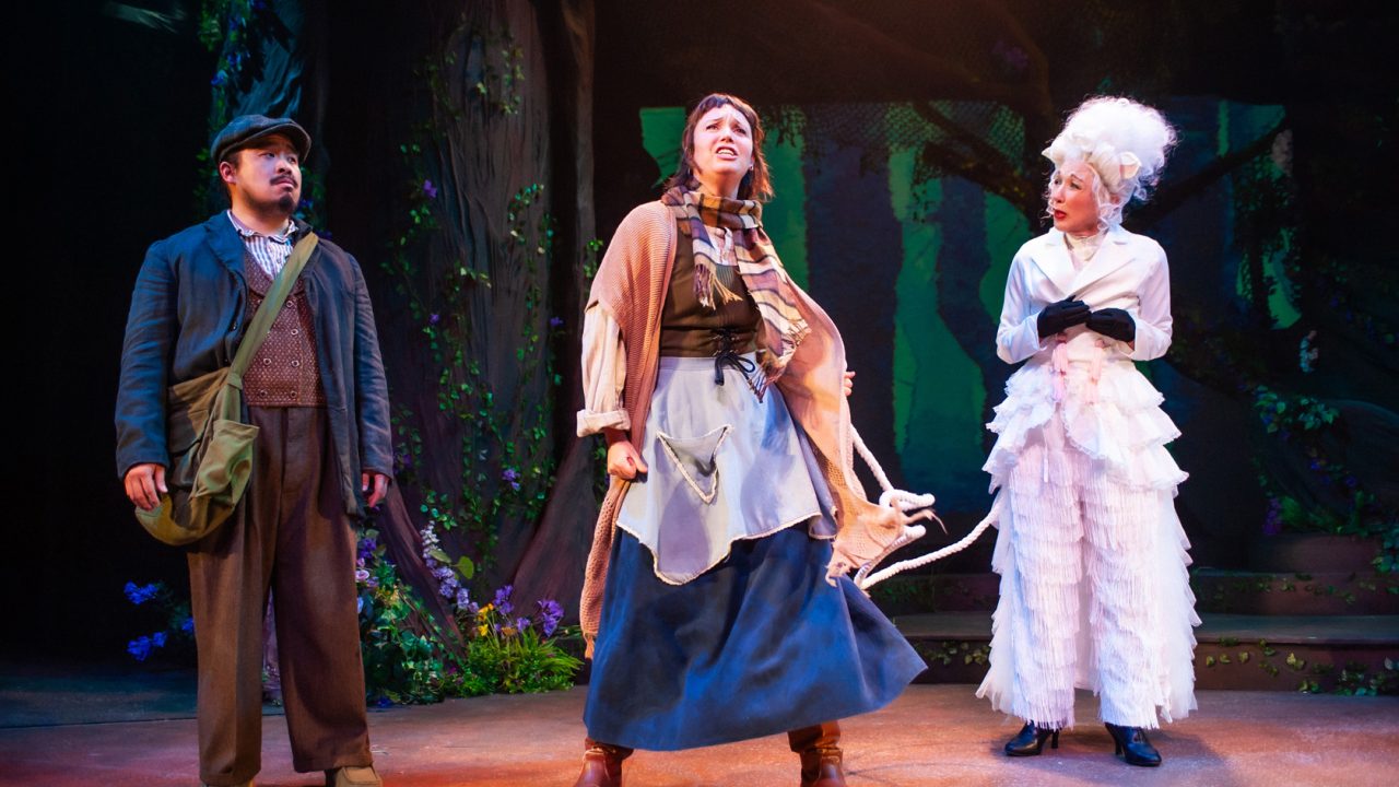 The Baker (Phil Wong) and The Baker's Wife (Ruby Day) have a plan for Milky White (Maureen McVerry) in San Francisco Playhouse's "Into the Woods," performing November 20, 2025 - January 17, 2026. The Baker (Phil Wong) and The Baker's Wife (Ruby Day) have a plan for Milky White (Maureen McVerry) in San Francisco Playhouse's "Into the Woods," performing November 20, 2025 - January 17, 2026.