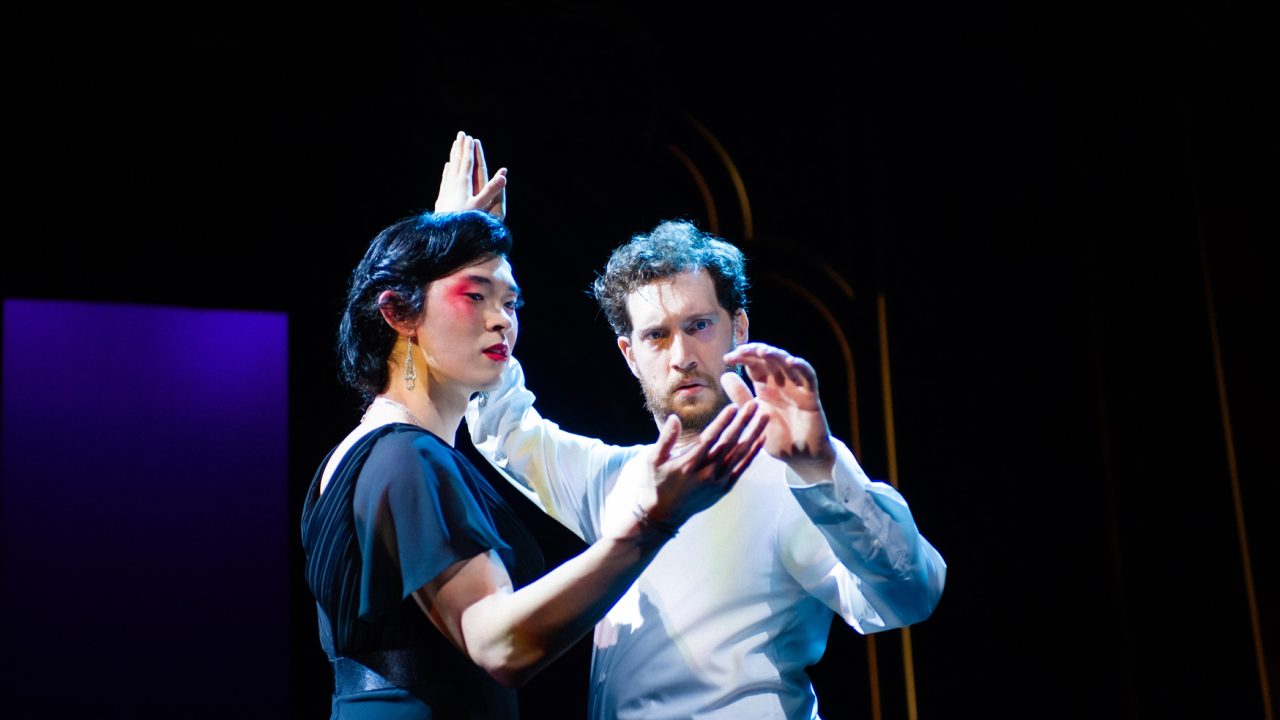 Song Liling (Edric Young) and Rene Gallimard (Dean Linnard) share a moment in San Francisco Playhouse's "M. Butterfly," performing February 5 - March 14, 2026. Song Liling (Edric Young) and Rene Gallimard (Dean Linnard) share a moment in San Francisco Playhouse's "M. Butterfly," performing February 5 - March 14, 2026.