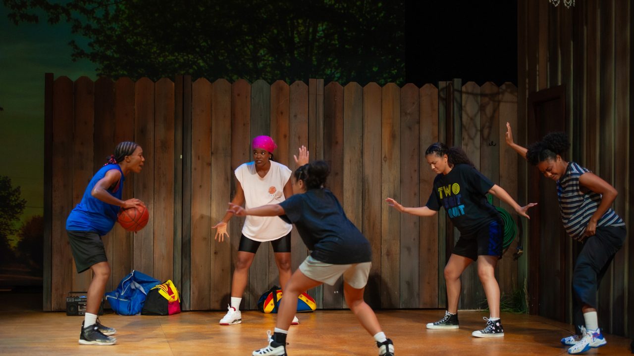 Lady Train teammates (l to r: Santeon Brown, Paige Mayes, Camille Collaço, Emma Gardner, and Courtney Gabrielle Williams) play a pickup game in San Francisco Playhouse's "Flex," performing March 26 - May 2, 2026. Lady Train teammates (l to r: Santeon Brown, Paige Mayes, Camille Collaço, Emma Gardner, and Courtney Gabrielle Williams) play a pickup game in San Francisco Playhouse's "Flex," performing March 26 - May 2, 2026.