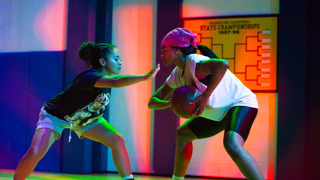 April (Camille Collaço) defends against Sidney (Paige Mayes) in San Francisco Playhouse's "Flex," performing March 26 - May 2, 2026. April (Camille Collaço) defends against Sidney (Paige Mayes) in San Francisco Playhouse's "Flex," performing March 26 - May 2, 2026.