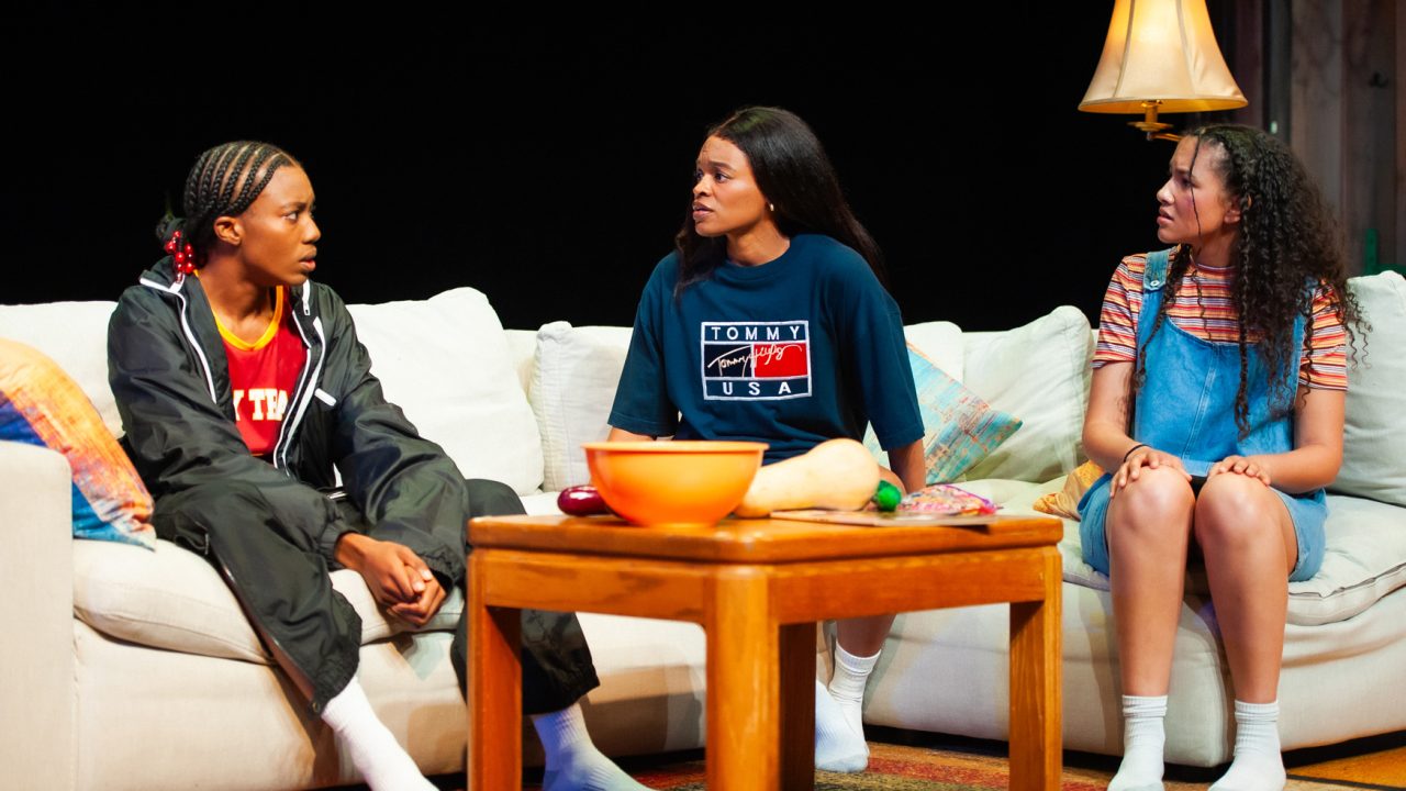Starra (Santeon Brown) reveals a secret to Sidney (Paige Mayes) and Cherise (Emma Gardner) in San Francisco Playhouse's "Flex," performing March 26 - May 2, 2026. Starra (Santeon Brown) reveals a secret to Sidney (Paige Mayes) and Cherise (Emma Gardner) in San Francisco Playhouse's "Flex," performing March 26 - May 2, 2026.