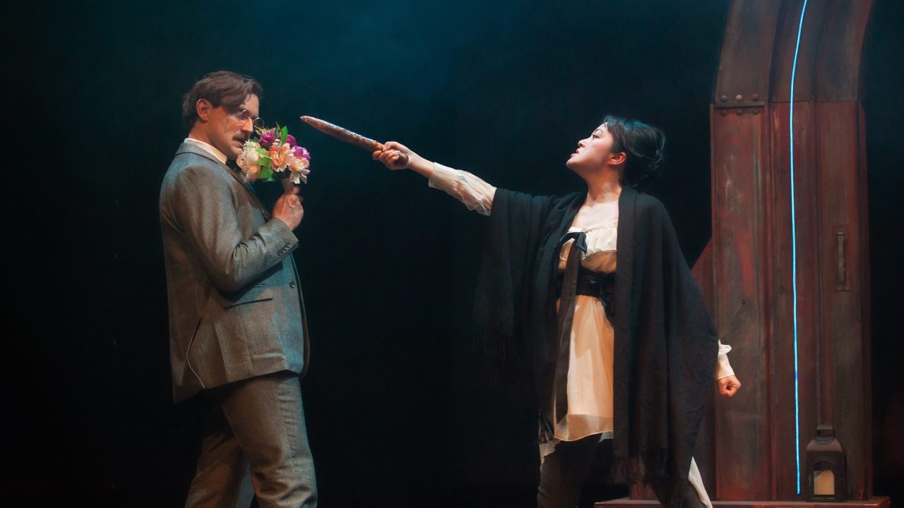 Seward (Josh Schell) is threatened by Mina (Sharon Shao) in San Francisco Playhouse's "Dracula: A Feminist Revenge Fantasy, Really," performing May 14 - June 27.