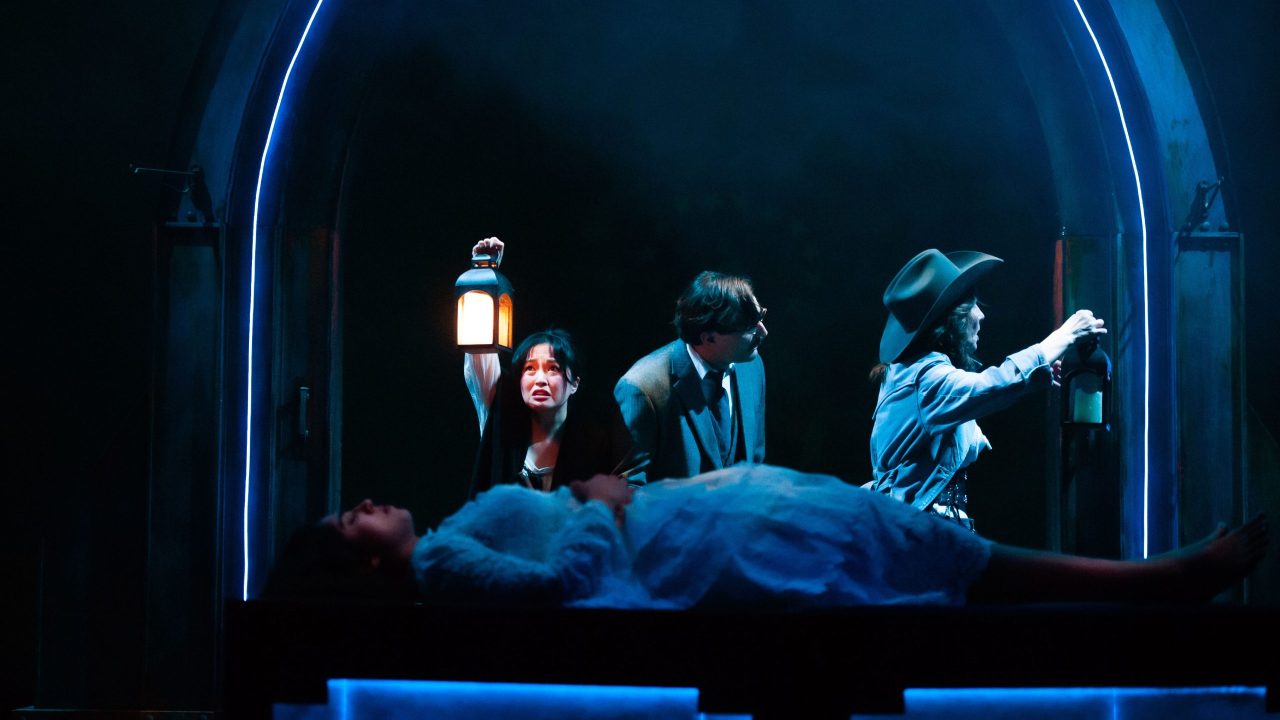 Mina (Sharon Shao), Seward (Josh Schell), and Van Helsing (Susi Damilano) visit Lucy (foreground - Nemma Adeni) in San Francisco Playhouse's "Dracula: A Feminist Revenge Fantasy, Really," performing May 14 - June 27.