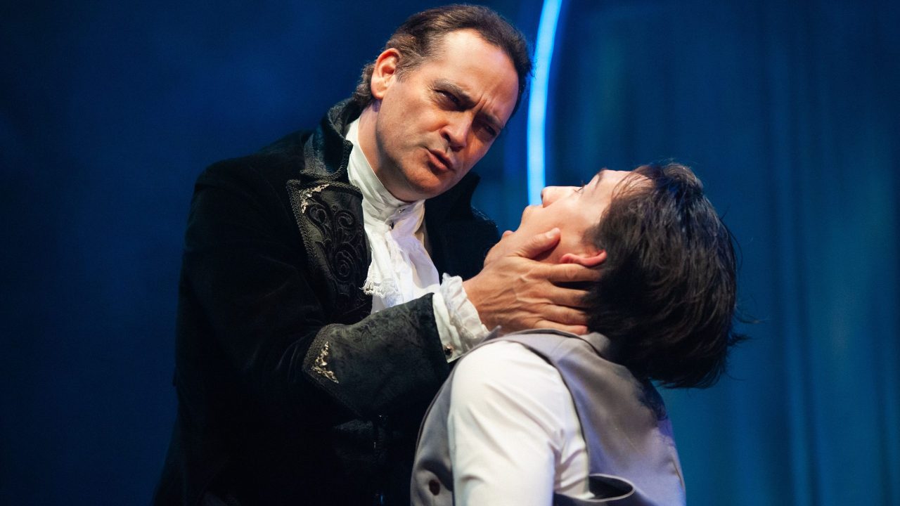 Dracula (Johnny Moreno) threatens Jonathan (James Aaron Oh) in San Francisco Playhouse's "Dracula: A Feminist Revenge Fantasy, Really," performing May 14 - June 27.