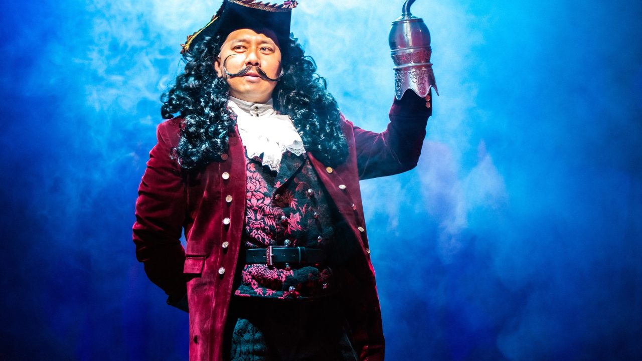 Jomar Tagatac as Captain Hook in San Francisco Playhouse's "Peter Pan Goes Wrong," performing September 26 - November 28.